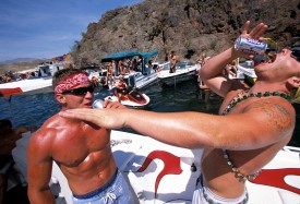 Two-men-drink-and-party-at-Lake-Havasu-on-Memorial-Day-weekend