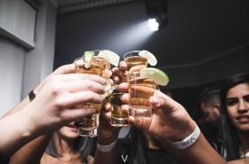 photo of cheers with tequila shots